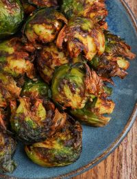 Air Fryer Smashed Brussels Sprouts on blue plate