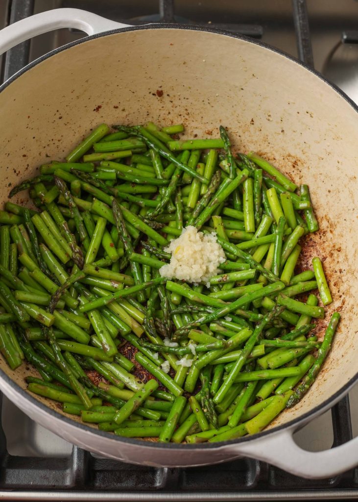 asparagus and garlic in enamel pot