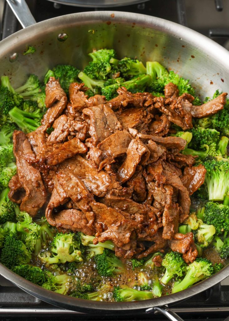 beef and broccoli in stainless pan