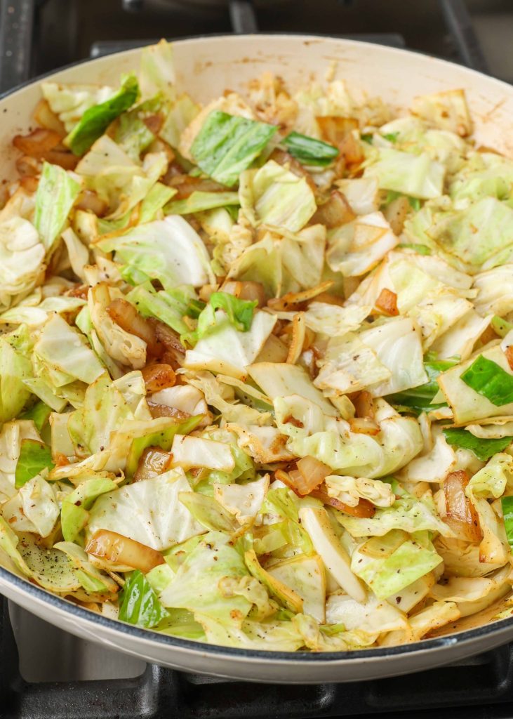 Cabbage and Sausage sauteing cabbage