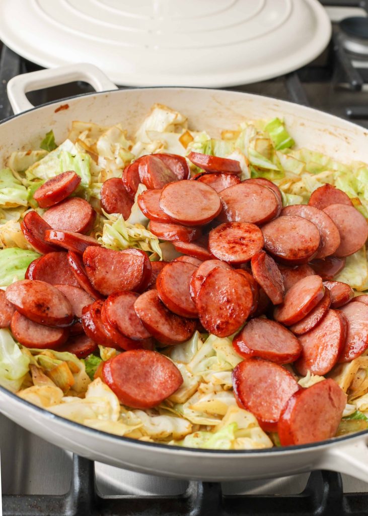 Cabbage and Sausage cooking with cabbage and sausage
