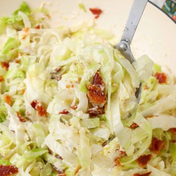 Creamed Cabbage with Bacon on large serving spoon