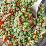 peas, cheddar cheese, and bacon salad in bowl