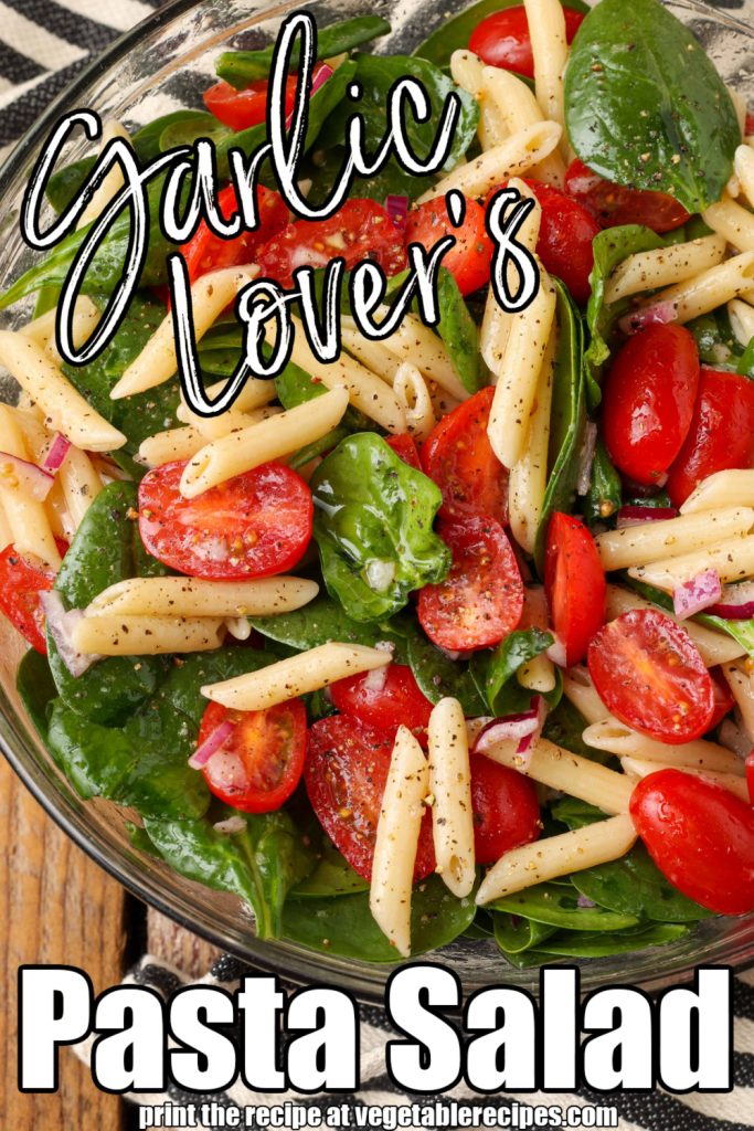 close up of pasta salad with spinach and tomatoes