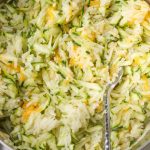 cheesy zucchini rice in pot with fork