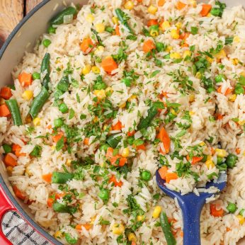 green beans, carrots, and corn are mixed into this rice skillet