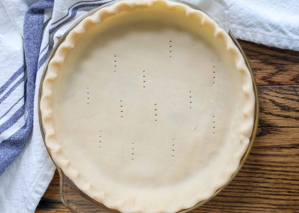 a pyrex pie dish lined with a pie crust