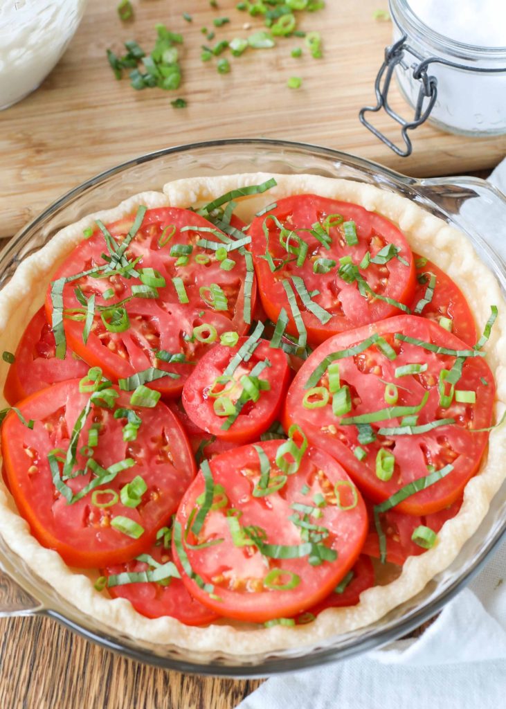 slices of tomato are layered into this pie dish