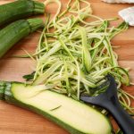zucchini sliced into noodles with a julienne peeler