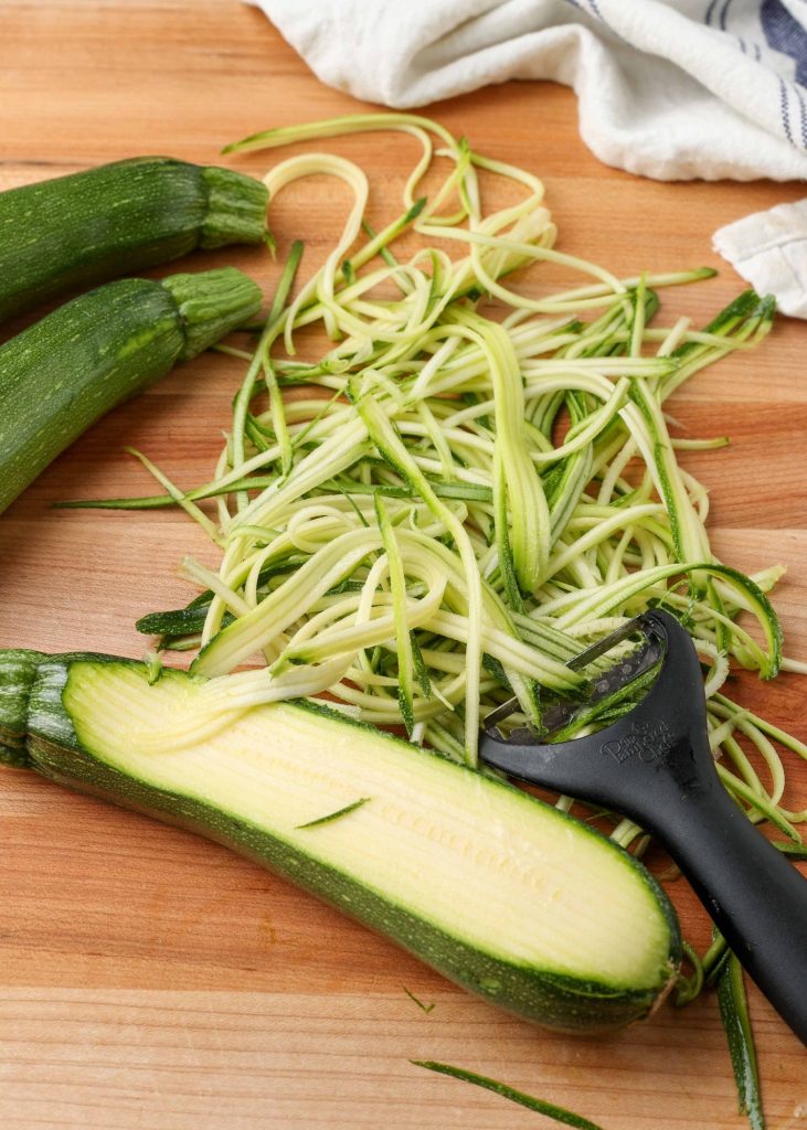 zucchini sliced into noodles with a julienne peeler