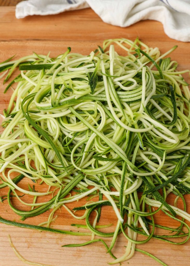 zucchini string noodles on cutting board