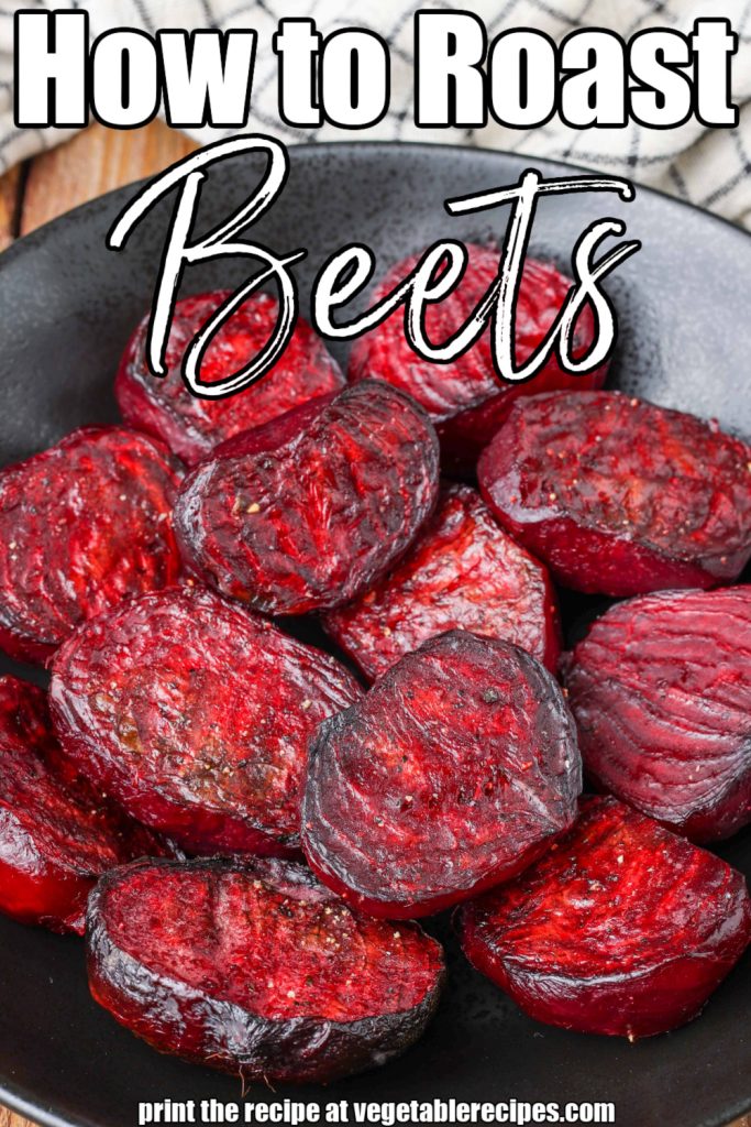 a close up image of roasted beets on a black plate