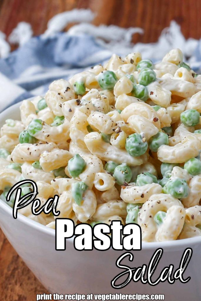 Vertical creamy pea pasta salad with bacon and cheese in a white bowl with a striped blue and white towel