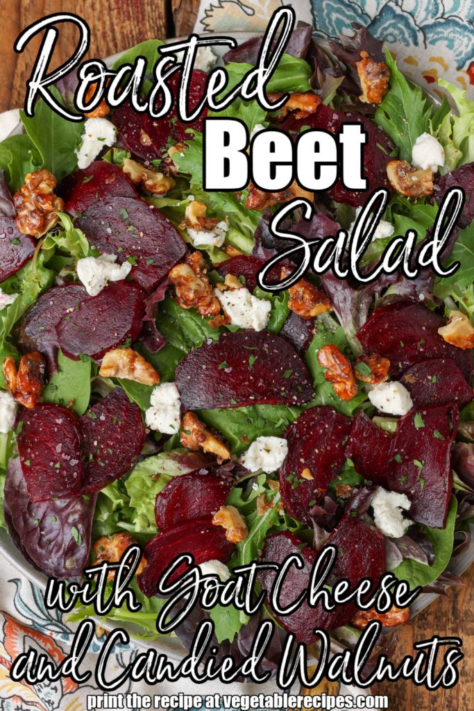 a roasted beet salad has bits of goat cheese and candied walnuts atop it, ready to serve