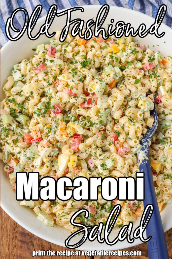 White lettering has been overlaid this top down shot of a large bowl of macaroni salad. it reads, "Macaroni Salad"