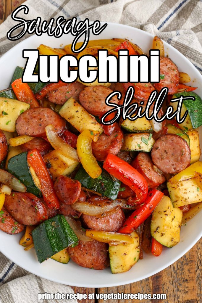 white lettering has been overlaid this image of a bowl full of sausage, peppers, and zucchini. it reads, "sausage zucchini skillet".