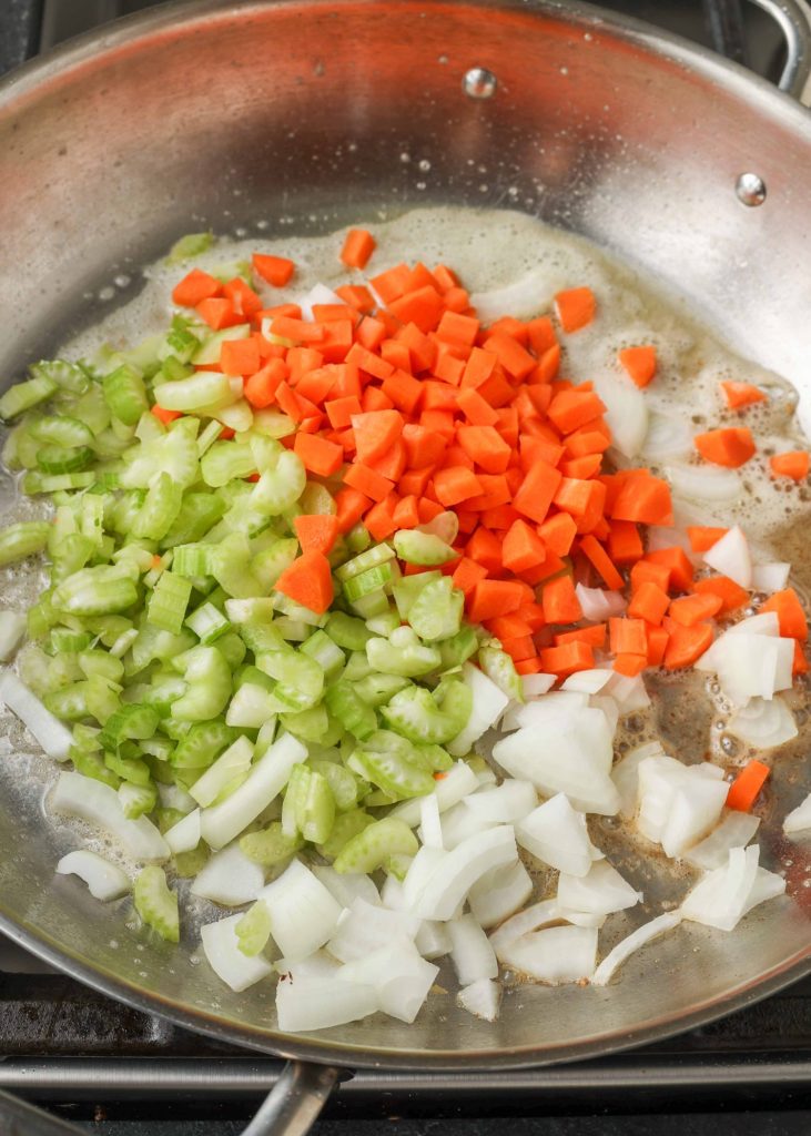 celery, carrots, and onions in saucepan