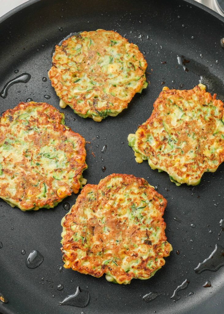 cooked fritters in skillet