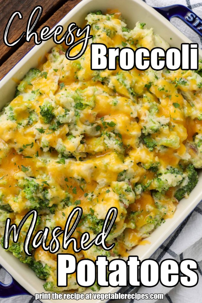 Overhead vertical shot of cheesy broccoli mashed potatoes, served in a white baking dish with blue trim and a checkered white and black hand towel