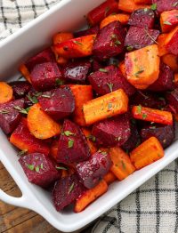 beets and carrots in rectangular baking pan on checkered cloth