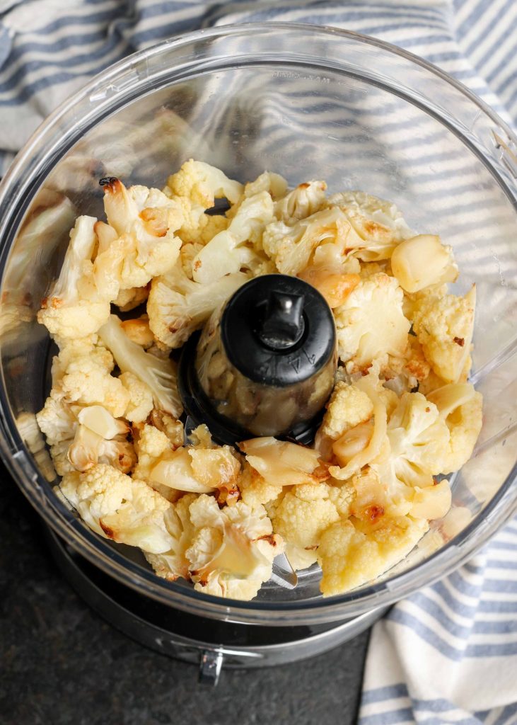 roasetd garlic and cauliflower in food processor