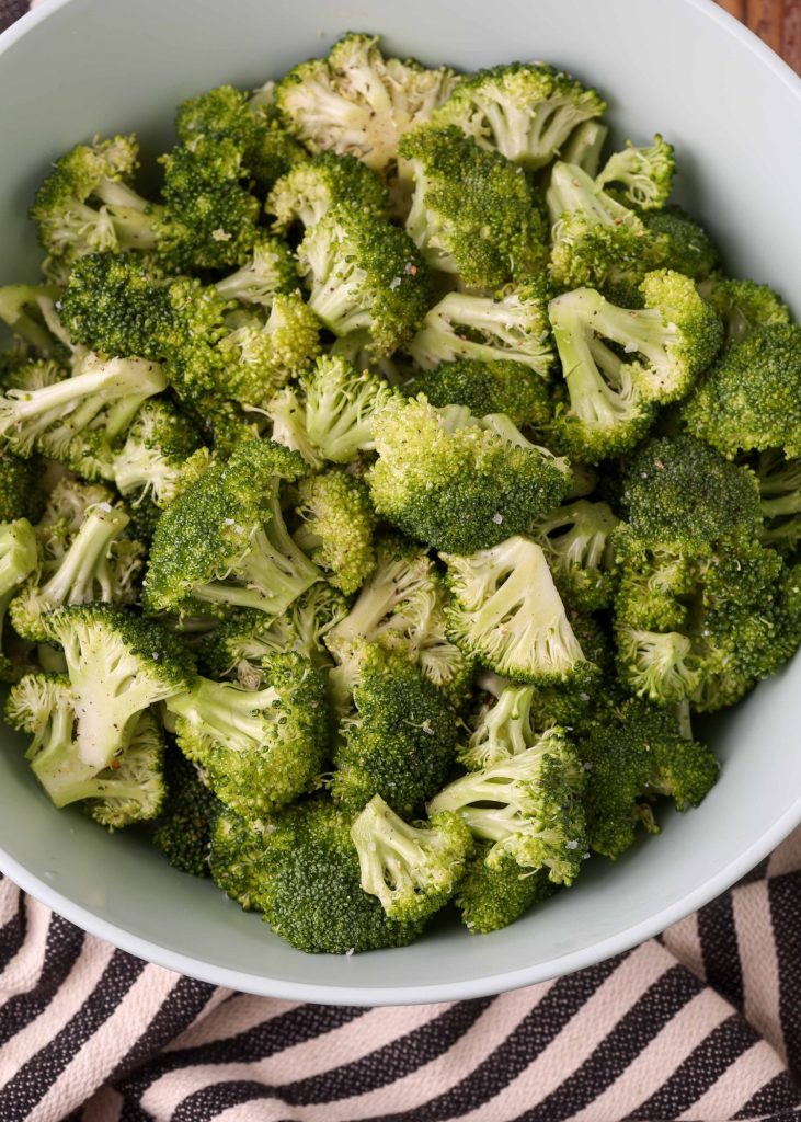 raw broccoli in white bowl