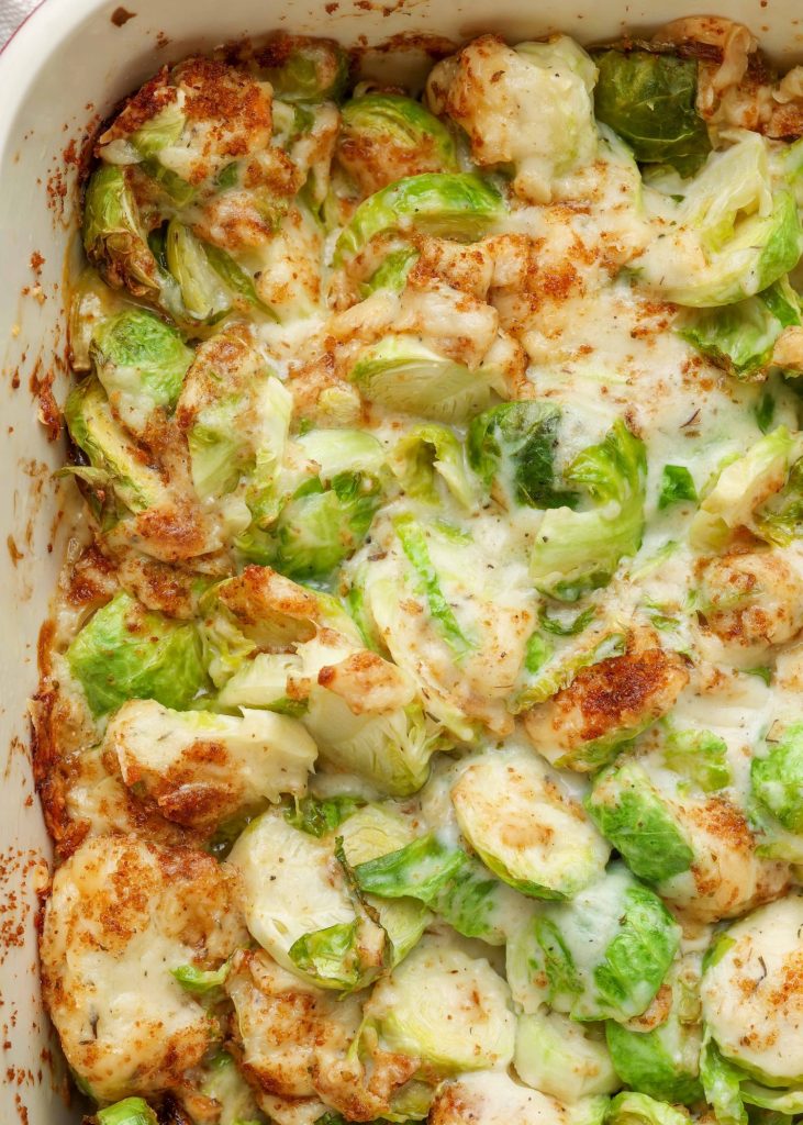 close up of Brussels sprouts au gratin in baking dish