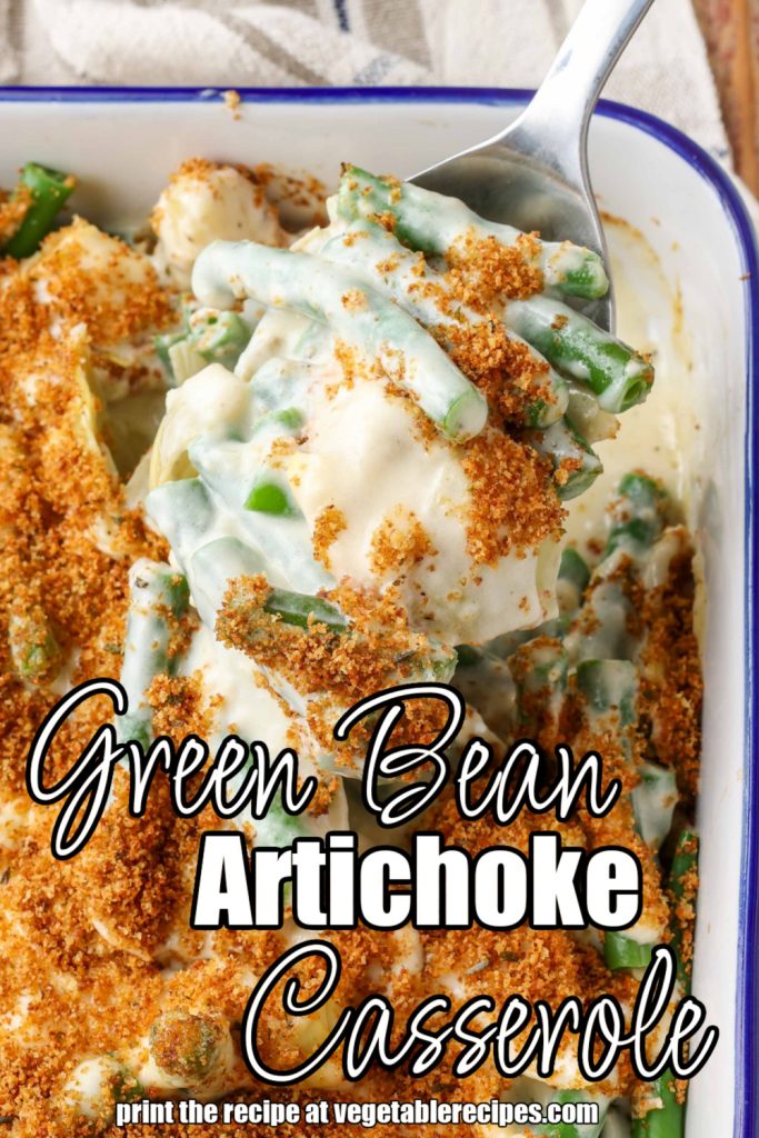 Green Bean Artichoke Casserole on serving spoon in white baking dish