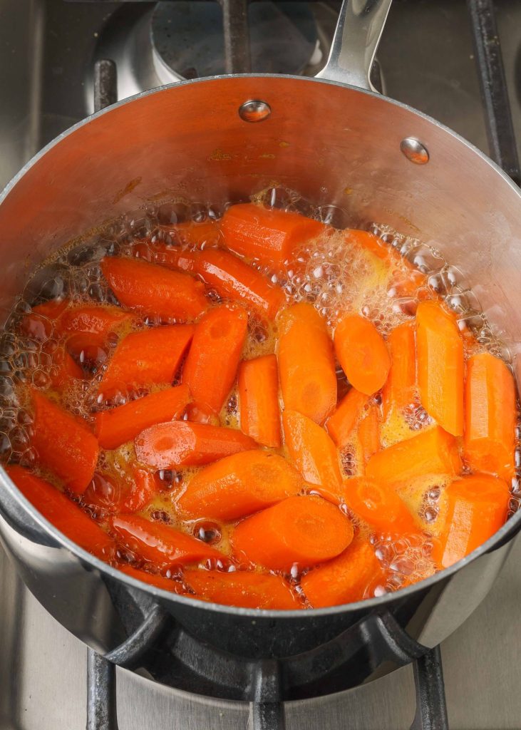 Carrots boiling in pan
