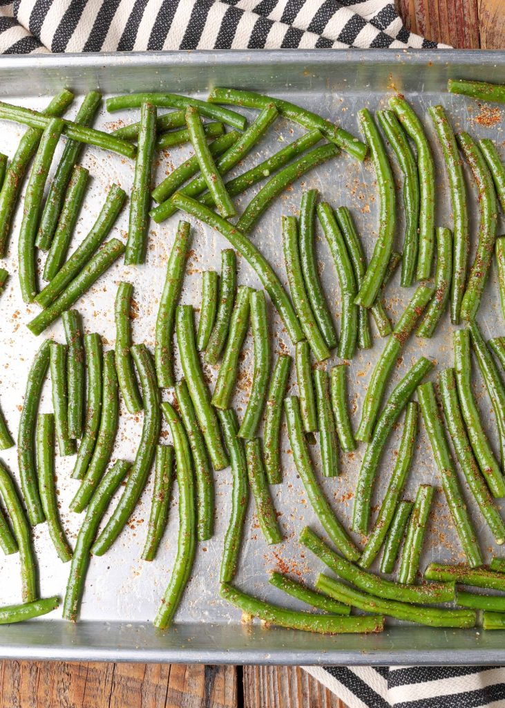 Horizontal shot of green beans on baking sheet