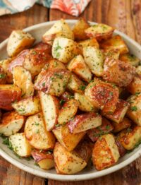 A top down image of a plate of red potatoes.