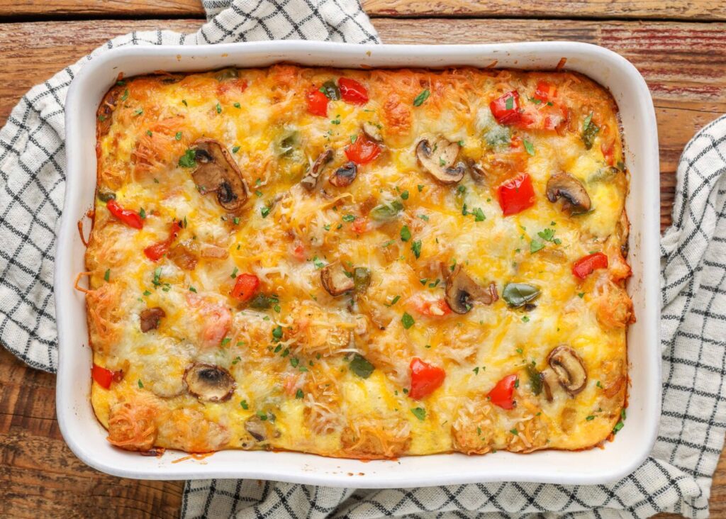 At last, the casserole is ready to serve, topped with loads of gooey cheese.