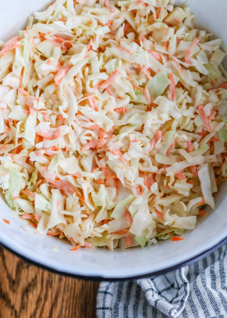 The coleslaw is ready to serve, tossed and dressed.