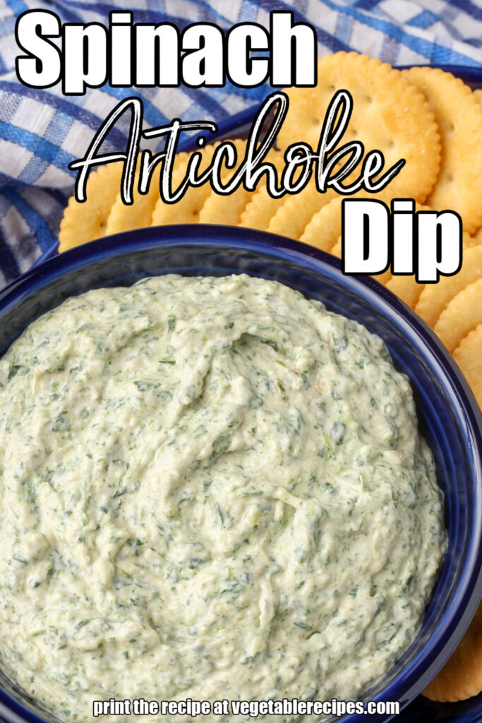 spinach dip in blue bowl surrounded by crackers