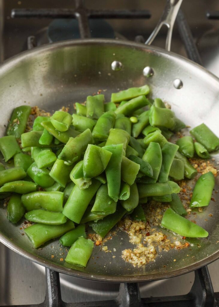 Green beans and garlic in skillet
