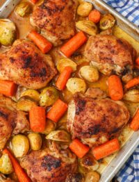 Chicken with Carrots and Brussels sprouts on baking sheet