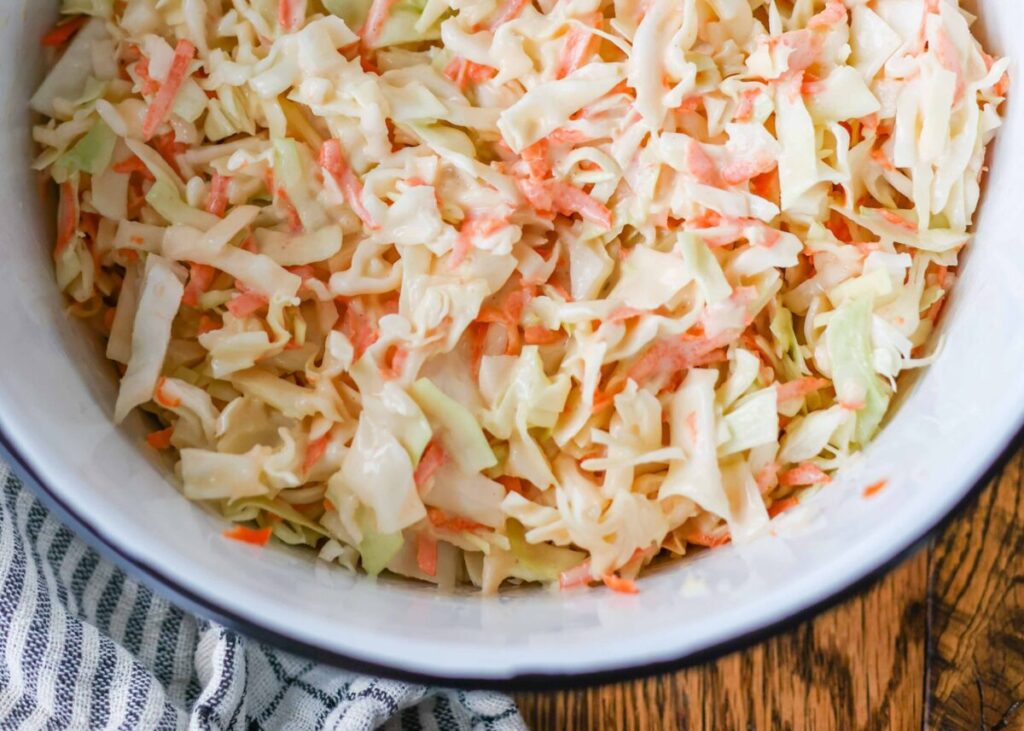 a bowl of chick fil a style coleslaw with cabbage and carrots
