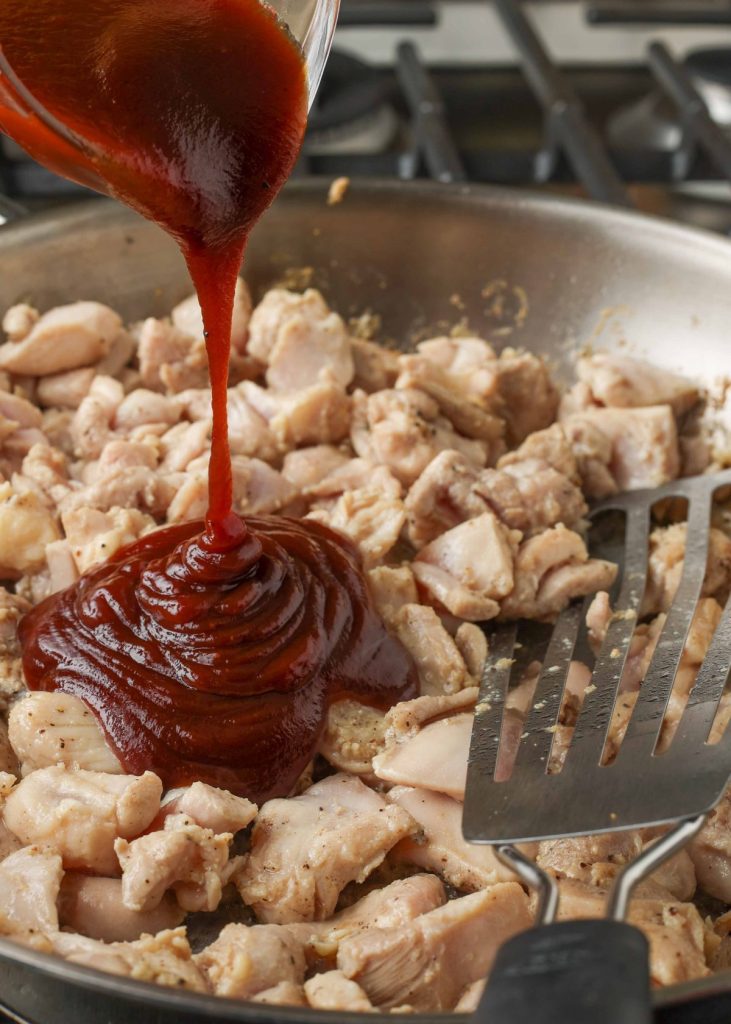 chicken in skillet with bbq sauce