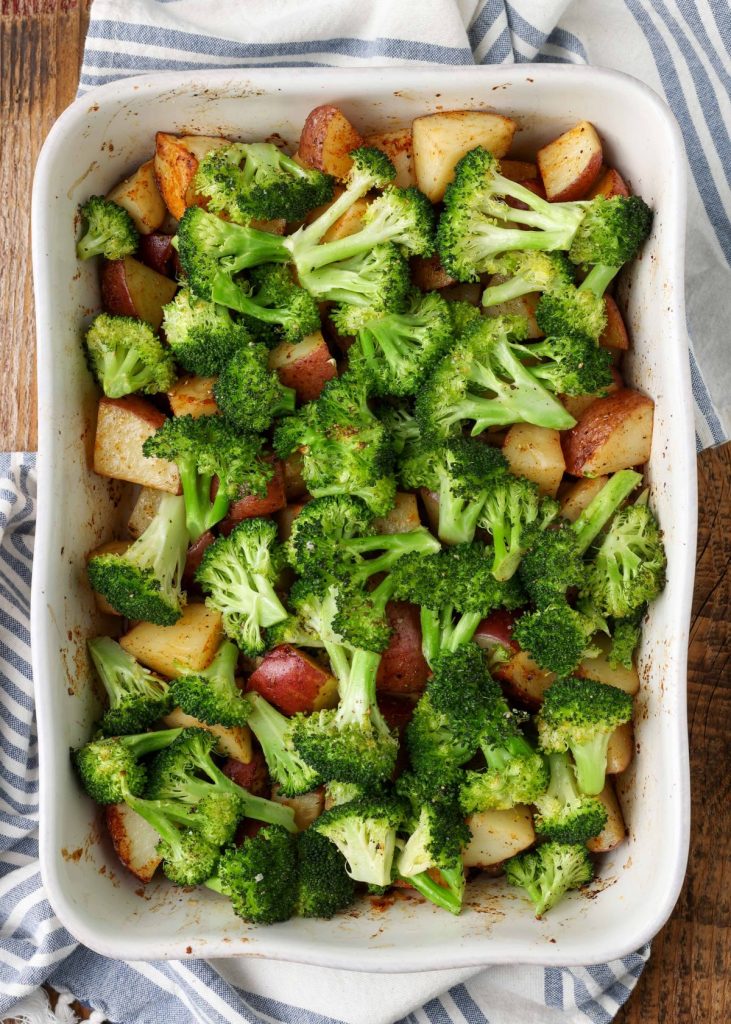potatoes and broccoli in roasting dish
