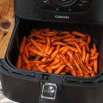 cooked sweet potato fries in air fryer basket