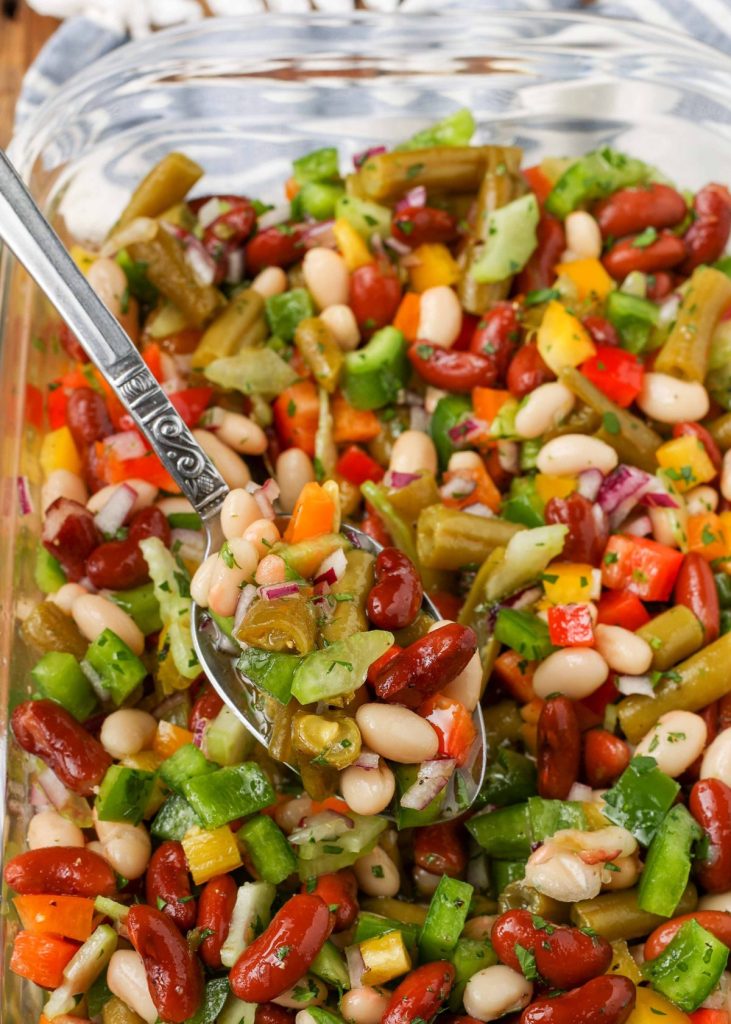 bean salad in dish with serving spoon