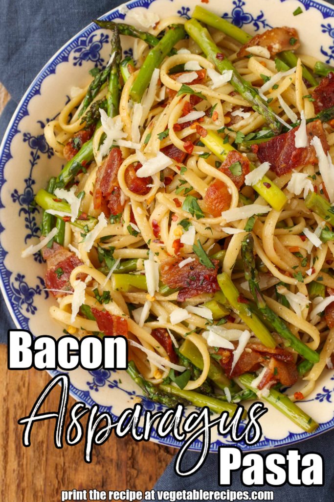Bacon pasta with asparagus in blue and white bowl with blue napkin