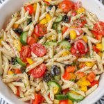 pasta with vegetables in white serving bowl