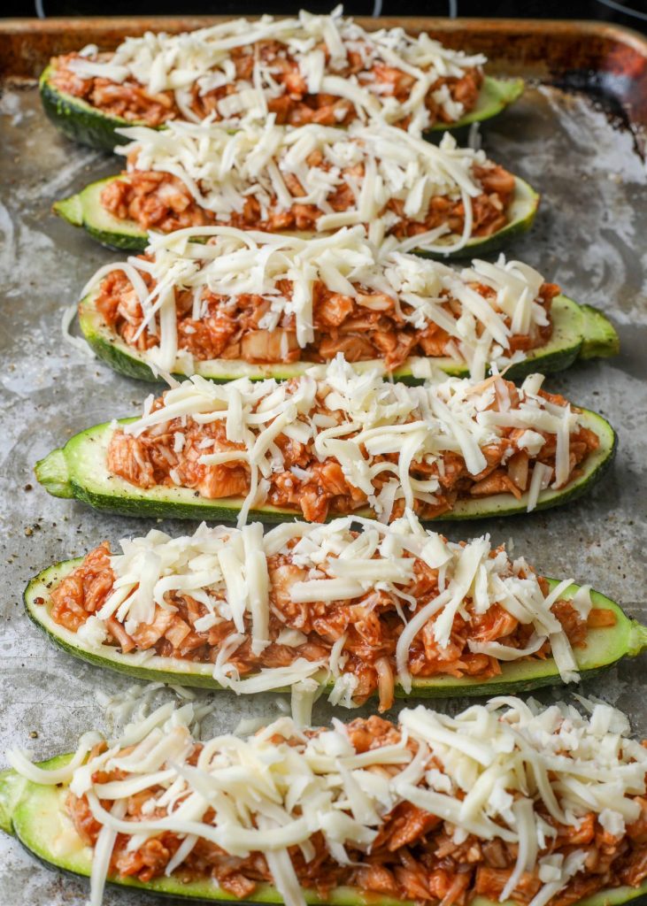 Zucchini filled with bbq chicken and cheese before cooking