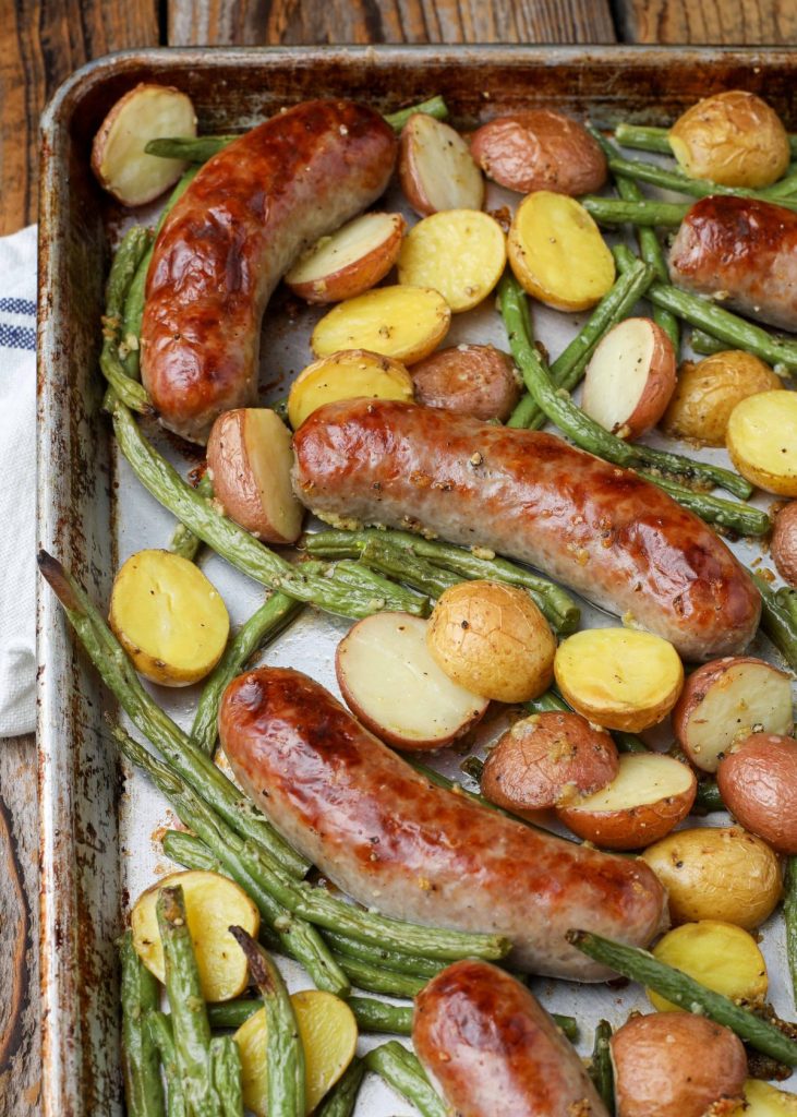potatoes, green beans, and brats on sheet pan