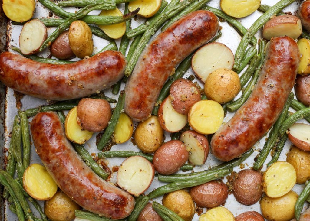 Brats in the oven with green beans and potatoes