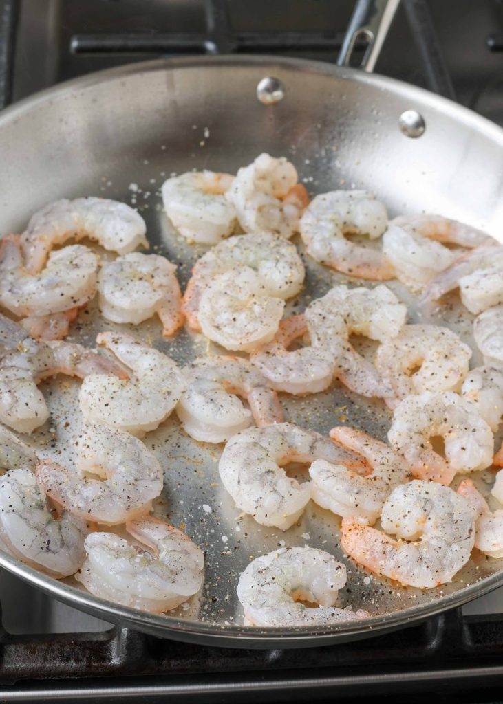 raw shrimp in skillet
