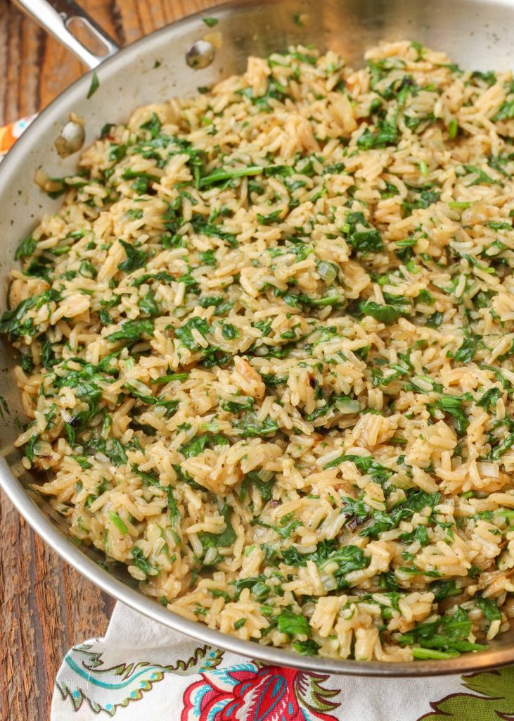 rice with spinach in large skillet