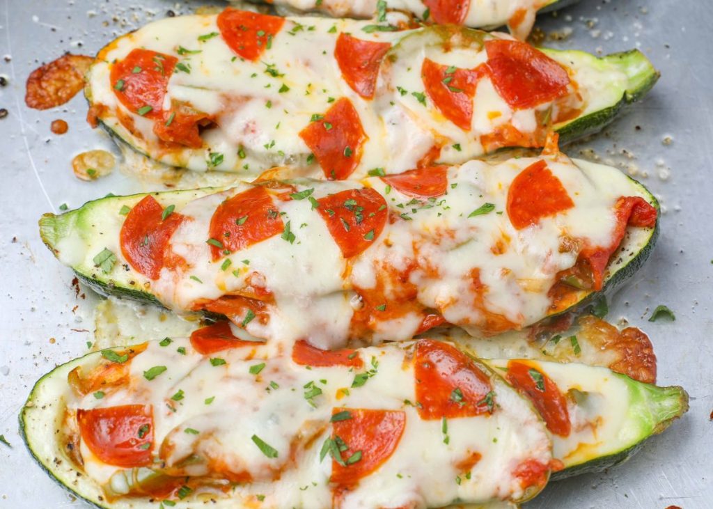Zucchini Boats filled with peppers and onions with cheese and pepperoni
