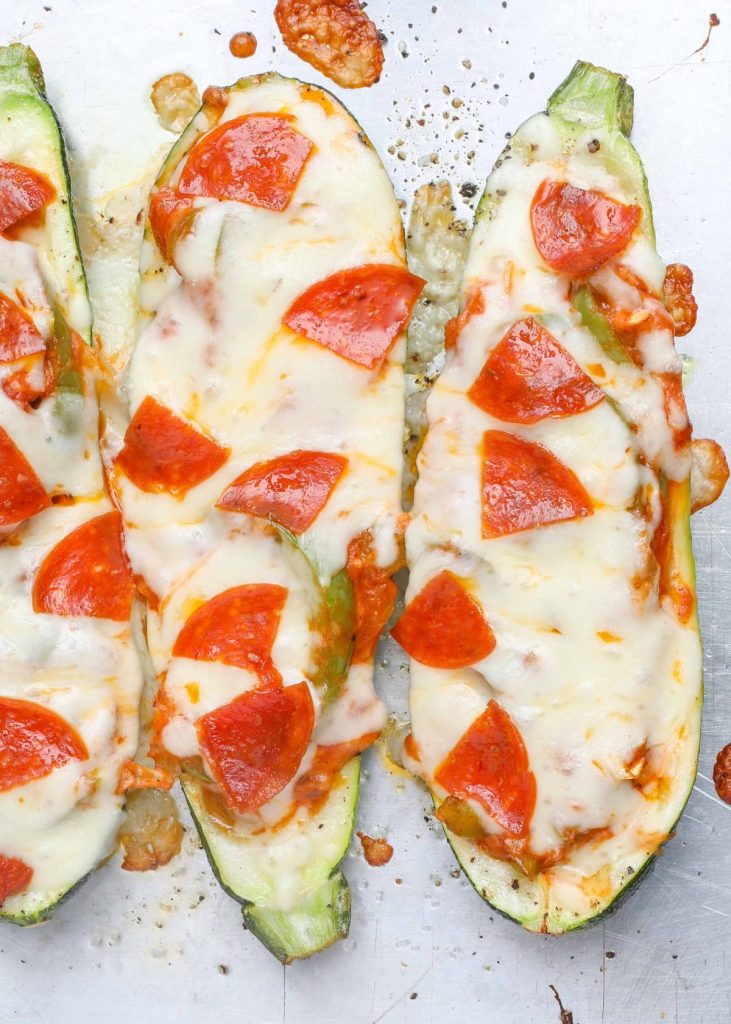 Fresh zucchini filled with pizza toppings